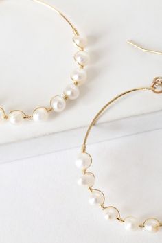 Escape to the ocean whenever you wear the Lulus Take Me to the Beach Gold and Pearl Hoop Earrings! These lightweight wire hoops dangle from fishhook backs and are decked out with darling freshwater pearls that are secured with wrapping wire. Fishhook backs. 1. 5" diameter. Metal and semi precious. Imported. Lulus | Take Me to the Beach Gold and Pearl Hoop Earrings. Everyday Wire Wrapped Hoop Earrings, Pearls Clothes, Take Me To The Beach, Pearl Hoop Earrings, Fish Hook, The Ocean, Freshwater Pearls, Semi Precious, Pearl Necklace