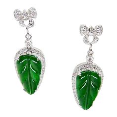 This is a very special pair of earrings. Made with the best imperial jade. They GLOW! The jade in these earrings are certified by 2 labs to be natural jadeite jade. The earrings are set in 18k white gold with posts backs. There are 2 carved imperial green jade leaf motifs and approximately 0.25cts of white diamonds that make up these earrings. The imperial green jade is carved with a leaf motif. The meaning behind the jade leaf carving is that the wearer will receive good fortune and richness. J Imperial Jade, Leaf Carving, Leaf Motif, Be Natural, Jade Jewelry, Natural Jade, Green Jade, Jewelry Business, Belleza Natural