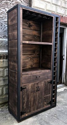 a large wooden cabinet sitting on the side of a building next to a brick wall