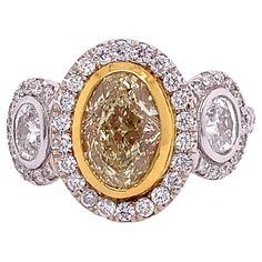 18K White and Yellow Gold Fancy Diamond: 1.71ct total weight. Diamond: 1.83ct total weight. Chanel Art, Fancy Yellow Diamond, Gold Solitaire Ring, Contemporary Ring, Fancy Diamonds, Oval Cut Diamond, Diamond Solitaire Rings, Yellow Diamond, Oval Diamond