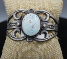 Golden Hills Turquoise and Sterling Silver Cuff Bracelet weighs 50.34 grams and has an antiqued finish with intricate carving. It measures 5 1/2" inside diameter with a 1" gap The stone is 1" long and 2/4" wide and is bezel set Antique Patina Cuff Bracelet Collectible, Antique Stamped Turquoise Jewelry, Antique Turquoise Bangle Cuff Bracelet, Antique Turquoise Cuff Bracelet Gift, Antique Turquoise Cuff Bracelet As Gift, Antique Turquoise Cuff Bracelet For Gift, Golden Hill, Sterling Silver Cuff Bracelet, Sterling Silver Cuff