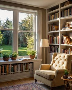 a living room filled with lots of furniture and bookshelves next to a window