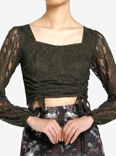 Bring flirty romantic vibes to your look with this olive lace crop top. Featuring double ruching detailing on the front and ruffle trimming at the cuffs.95% cotton; 5% spandexWash cold; dry lowStretchy materialLength: 25''ImportedListed in junior sizesModel is 5'10''Model wears size Small Romantic Vibes, Cropped Long Sleeve Top, Tall Hoodies, Plus Size Fits, Lace Crop Tops, Socks And Tights, Green Lace, Sweaters And Jeans, Girl Top