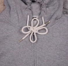 the hoodie is tied up and ready to be worn