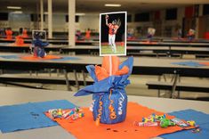 an orange and blue bag with a photo on it sitting on top of a table