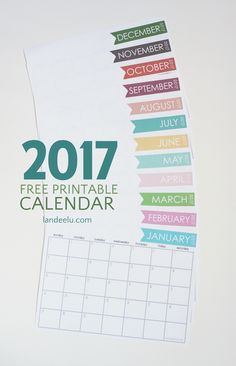 a calendar with the words free printable calendar on it and colorful ribbons around it