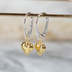 ✨Pretty Gold Heart Charm & Sterling Silver Lever Back Earrings✨ ⭐️  DIMENSIONS:  Charm measures 9mm, Lever-back earrings base measures 17.70x10.20mm   ⭐️ MATERIALS:  925 Sterling Silver, 24K Gold (plated on a sterling silver base).  N.B. For hygiene reasons, we regret we are unable to accept returns for earrings unless faulty. ⭐️  Handmade By us in UK ⭐️ PACKAGING:  All items come in a luxury drawstring pouch. If you are sending as a gift, you have the option to upgrade to a Isobel Jackson Jewel Heart Charm Drop Earrings For Mother's Day, Mother's Day Heart Drop Earrings, Pierced Heart Drop Earrings For Mother's Day, Mother's Day Pierced Drop Heart Earrings, Mother's Day Pierced Heart Drop Earrings, Pierced Dangle Heart Earrings For Mother's Day, White Gold Heart Charm Dangle Earrings, White Gold Dangle Earrings With Heart Charm, Teardrop Earrings With Heart Charm For Anniversary