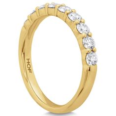 Nine strikingly stunning diamonds stand together to create this Hearts On Fire signature band.- 18K YELLOW GOLD.- DIAMOND WEIGHT: 0.47 CTW.- DIAMOND QUALITY: GH (NEAR COLORLESS) VS (VERY SLIGHTLY INCLUDED).- FINGER SIZE: 6.5.- Also available in Platinum, White or Rose Gold.- Can be ordered in most finger sizes.- Price may vary by finger size and metal fluctuations.- **One Year Manufacturer's Warranty**. Gold Lab-grown Diamond Eternity Band For Anniversary, Yellow Gold Diamond Ring With Heart Cut, Yellow Gold Heart Cut Diamond Ring With Prong Setting, Dazzling Gold Eternity Band With Brilliant Cut, Heart Cut Yellow Gold Cubic Zirconia Wedding Ring, Dazzling Gold Half Eternity Wedding Ring, Yellow Gold Heart Cut Moissanite Diamond Ring, Yellow Gold Moissanite Eternity Band With Prong Setting, Yellow Gold Diamond Eternity Band With Baguette Cut