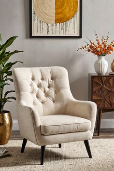 a living room scene with focus on the arm chair and potted plant in the corner