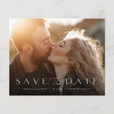 the save the date photo card is shown with an image of a man and woman kissing