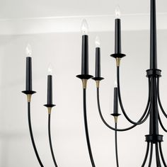 a black chandelier with eight lights hanging from it