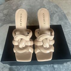 **Nwt Coach Kellie Leathr Sandal Size 38 Color Beechwood All Original Packaging Included Chic Coach Leather Sandals, Coach Beige Open Toe Sandals, Coach Beige Leather Sandals, Coach Leather Sandals With Cushioned Footbed, Coach Leather Slip-on Sandals, Coach High Heel Sandals With Padded Heel, Coach Leather Sandals For Spring, Chic Beige Coach Heels, Coach Beige Sandals With Round Toe