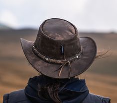 "Genuine leather hats, Personalized hats from Wombat Outdoor Leather style Australian Bush Hats For any campers or hikers planning their trips during the spring and summer check out this rugged camouflage brown leather hat which we have called The Wilds. It is the perfect hat to take away with you on holiday, as the soft foldable/crushable leather allows it to be packed away without taking up too much or affecting the shape when you take it back out. The hat stays looking strong and durable with the worn effect giving it a classically aged appeal. When you head out into the country to explore the wide open spaces you need accessories that are functional and this soft leather hat ticks those boxes while also being incredibly stylish. Not only that, but the unique leather grain found on each Country Style Wide Brim Top Hat For Outdoor, Brown Western Top Hat For Outdoor, Western Style Short Brim Top Hat For Outdoor, Western Style Top Hat With Short Brim, Western Style Short Brim Top Hat, Brown Top Hat With Short Brim For Outdoor, Western Flat Brim Hats For Outdoor Activities, Brown Brimmed Top Hat For Outdoor, Brown Top Hat With Short Brim For Outdoor Events