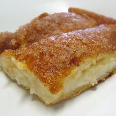 a close up of a piece of cake on a plate with crumbled toppings