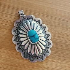 A big, beautiful sterling silver stamped concho pendant with turquoise. The pendant is stamped out in New Mexico and sent to me unfinshed.  I use hand tools to file and form it, solder and set the bezel and bale, then stamp, oxidize and polish it to a high shine. It is completely hand-finished by me here in bee-utiful Tucson, AZ. I've set a high-quality blue 12mm x 7mm turquoise cabochon in the center. I've also soldered the bale closed for security. The bale can accommodate a 3mm chain or a fat leather cord, or you can add it to your southwestern-style beaded necklace as you make it! Pendant measures approximately 2" long x 1 1/2" wide, and is stamped .925 on the back.  ♥ large pendant measures approximately 2" long x 1 1/2" wide ♥ stamped from 22 gauge sterling silver, sturdy but not too Bee Utiful, Rodeo Cowgirl, Southwest Jewelry, Western Rodeo, Southwest Style, Tucson Az, Robins Egg Blue, Southwestern Style, Leather Cord