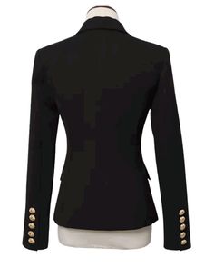 Tanya Black Double Breasted Blazer with Gold Buttons - SLIM FITFeatures: - Slim Fit Design - Single Gold Button Closure - Gold Button Cuffs - Peak Lapels - Two Faux Side Pockets - Shoulder Padding The Tanya Black Double Breasted Blazer is the ultimate must-have for any wardrobe: the perfect classic black blazer for women. This blazer is expertly crafted to perfection, with an exquisite blend of style and functionality that is sure to impress. The gold button detailing adds a touch of luxury and elegance, bringing a timeless appeal to this already classic piece. The double-breasted design is the epitome of sophistication and creates a figure-flattering silhouette that is both feminine and powerful. Our Tanya Black Double Breasted Blazer is designed for versatility, making it perfect for any Black Blazer For Women, Black Double Breasted Blazer, Blazer For Women, Breasted Blazer, Double Breasted Blazer, Black Blazer, Gold Buttons, Blazers For Women, Modern Woman