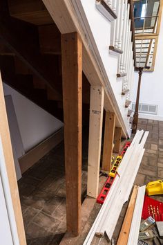 there are many pieces of wood under the stairs