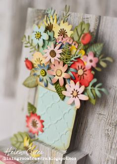 a close up of a wooden chair with flowers on it