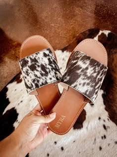 Genuine cowhide sandals! These are perfect for your Nashville trip or even just brunch out! Cowhide will be dark (blacks/greys/chocolate browns) or light (chestnut browns, white, tans). often shoes will have white speckles and  spotting but can be solid as well. If you are particular about the pattern you receive please reach out and I'm more then happy to send photos.   Cowhide is genuine  disclaimer: this is made with genuine cowhide so while you can choose a general color scheme the pattern/a Brown Round Toe Flip Flops For Outings, Brown Leather Footbed Mules For Vacation, Comfortable Brown Sandals For Outings, Cowhide Sandals, Western Sandals, Cowhide Shoes, Light Chestnut Brown, Casual Country Outfits, Western Shoes