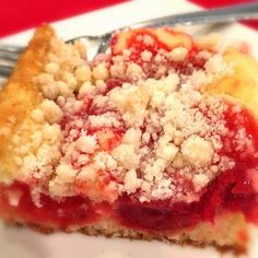 a close up of a piece of pie on a plate with a fork in it