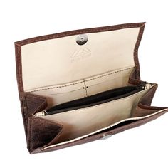 With so many ladies' wallets on the market, it's difficult to decide which one best fits your needs. We are here to help and believe we have some great options to consider. Our Handmade Brown Women’s Wallet is a comfortable way to carry your necessities. There are two bill compartments, 12 storage slots for cards and two open space compartments. The interior zipper pocket is perfect for those small items and loose change. Everything closes easily with a magnetic closure. Beyond its great appeara Leather Change Purse, Leather Camera Strap, Handmade Wallet, Lake Atitlan, Womens Wallet, Brown Leather Wallet, Loose Change, Handmade Wallets, Handmade Leather Wallet