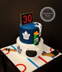 a hockey themed cake with the number 30 on top