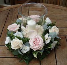 a flower arrangement is displayed on the table