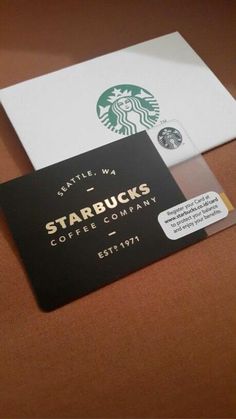 a starbucks card sitting on top of a table