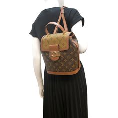 Item Details: The Louis Vuitton Dauphine PM Monogram Reverse is a true testament to timeless style. This handbag boasts the iconic LV monogram in a stunning reverse canvas, marrying heritage design with a contemporary twist. Elevate your ensemble with this classic piece that exudes luxury and sophistication. Model: Dauphine PM Style: Backpack Material: Monogram Reverse Canvas with Leather Trim Color: Brown Made: France Made Year: 2020 Date Code: SP0240 Measurements: W 8.5" D 6" H 9.5" Accessories: No Accessories. Condition Detail: Very Good - The Item is gently used and may have minor corner rubbing, light leather tanning, some inside stain marks, and slight signs of use on hardware. See the listing description for details. Outside: Signs of use. Inside: Light dirt, signs of use. Canvas: D Louis Vuitton Dauphine, Outside Signs, Leather Tanning, Pm Monogram, Reverse Canvas, Backpack Material, Lv Monogram, Balenciaga Designer, Canvas Backpack