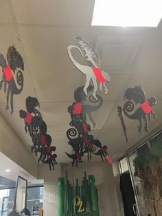 some paper cutouts are hanging from the ceiling