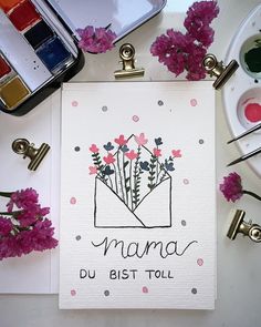 there is a card that says mama du bist toll with flowers in the envelope