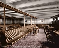 the interior of a restaurant with wooden benches, tables and chairs on carpeted flooring