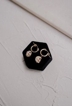 Gold filled huggie hoops adorned with the cutest howlite skull beads. White Skull Print Jewelry For Gift, White Skull Print Jewelry Gift, Sunglasses Necklace, Skull Beads, Melie Bianco, The Body Book, Book Candle, Beaded Skull, Crop Top Sweater