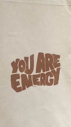 you are energy sticker on the side of a white bag with brown lettering that says, you are energy