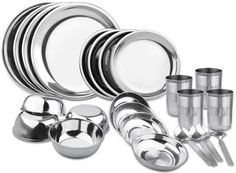 stainless steel dinnerware set with cups and saucers, including one for the table