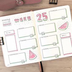 an open planner with watermelon slices on it and a pencil next to it