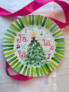 a plate with a christmas tree painted on it