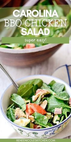 a bowl filled with spinach and chicken salad next to another bowl full of vegetables