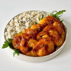 a white bowl filled with shrimp and rice