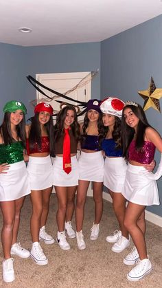 a group of girls dressed up in costumes