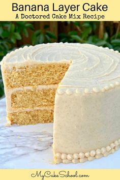 a banana layer cake with a slice missing from it