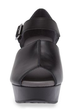 Go from day-to-night comfortably and in style with this sleek leather sandal designed with a smaller open toe and covered platform wedge. 2 1/2" heel; 1 1/4" platform Adjustable ankle strap with buckle closure Cushioned insole Leather upper and lining/rubber sole Imported Leather Wedge Sandals With Leather Footbed, Leather Closed Toe Sandals With Deep Heel Cup, Modern Closed Toe Wedge Sandals With Buckle, Modern Leather Wedge Sandals With Ankle Strap, Modern Leather Wedge Sandals With Heel Loop, Modern Leather Wedge Sandals Medium Width, Leather Block Heel Wedge Sandals, Leather Medium Width Wedge Heel Sandals, Modern Leather Open Toe Wedge Sandals