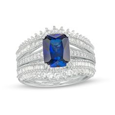 Celebrate your next steps in life and love with this captivating emerald-cut blue and white lab-created sapphire double-row three-piece bridal set. Fashioned in sleek sterling silver The engagement ring showcases a 9.0 x 7.0mm emerald-cut bright blue lab-created sapphire. Shimmering white lab-created sapphires glisten along the shank between intricate milgrain borders. Two milgrain-detailed wedding bands - each featuring a double row of baguette-cut and round white lab-created sapphires - comple Blue Radiant Cut Lab-created Sapphire Jewelry, Blue Square Cut Sapphire Jewelry, Blue Rectangular Lab-created Sapphire Jewelry, Blue Radiant Cut Stone Jewelry, Square Cut Blue Lab-created Sapphire Jewelry, Blue Square-cut Lab-created Sapphire Jewelry, Blue Lab-created Sapphire Jewelry, Square Cut, Blue Square Cut Lab-created Sapphire Jewelry, Dazzling Blue Emerald Cut Ring