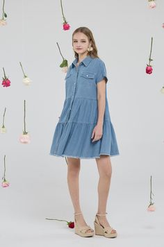 Product Description Introducing the Casual Short Sleeve Button Down Distressed Hem Flowy Tiered Babydoll Denim Shirt Dress with Pockets—an essential addition to your casual wardrobe that combines style and comfort. Made from high-quality, medium-washed cotton, this denim dress is naturally breathable and soft to the touch. The design features a lapel collar, functional buttons, and pockets, coupled with a high waistline and a subtle high-low hemline that enhance its stylish aesthetic. The babydoll silhouette is flattering for any body shape, making this piece as comfortable as it is fashionable. Details Material: Premium quality medium-washed cotton, breathable with no stretch. Care Instructions: Hand wash cold, hang dry, do not bleach, low iron if needed. Sizes Available: S, M, L, XL, XXL