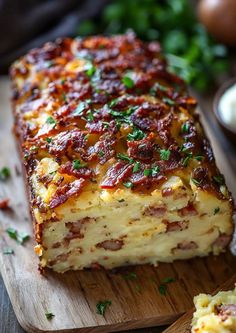 a close up of a piece of food on a cutting board next to other foods