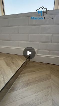 a video showing how to install a tile floor in the kitchen or living room with hardwood floors