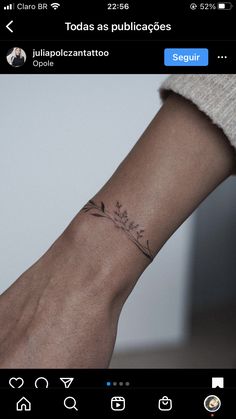 a person's arm with a small tattoo on it