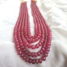 Stone : Ruby Grade : AA Size : 3.5 to 7.5 mm Beads Shape : Rondelle (Smooth) Color : Pinkish Weight : 1040 Carats Approx. (5 Strand) Strand length : 19 to 23 Inches Gemstone are made in Billions of Years in the Womb of Earth. Gemstones connect us widely to the universe and spirits. All the photographs of the item are captured in natural daylight. The photographs are uploaded without any enhancements or editing. All photographs depicts the color of Gemstone Accurately, color may vary slightly. Al Elegant Ruby Gemstone Beads, Elegant Round Spacer Beads, Ruby Beaded Necklace With Faceted Round Beads, Ruby Beaded Necklaces With Faceted Round Beads, Elegant Oval Gemstone Beads, Ruby Beaded Necklaces With Polished Round Beads, Ruby Beaded Necklaces With Round Beads, Ruby Beads, Ruby Gemstone