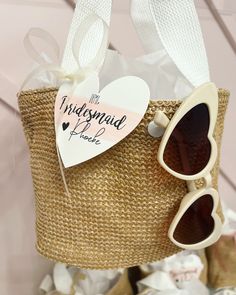 Straw mini bucket handbag! With your purchase you will receive: 1 straw bucket hand bag! 1 pair of heart tortoise sunglasses 1 personalized heart tag I will also include tissue paper inside each bag. Bags have a light pink handle and snaps closed! Size- 30*20*12 cm Trendy White Bucket Bag As Gift, Heart-shaped Summer Bags For Everyday Use, Heart-shaped Summer Bags For Gifts, Heart-shaped Summer Bag For Gifts, Heart-shaped Summer Gift Bags, White Bucket Straw Bag As Gift, Summer White Bucket Bag Gift, White Bucket Bag As A Gift, White Bucket Bag As Summer Gift