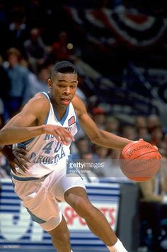 a basketball player dribbling the ball during a game